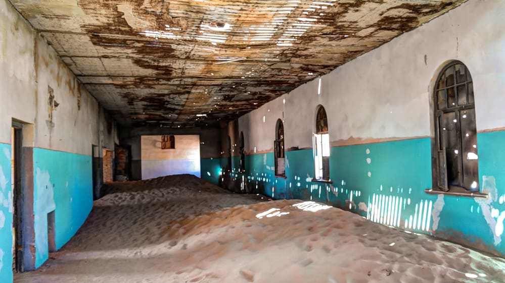 Interior of ruined house in ghost-town Kolmanskop, Namibia