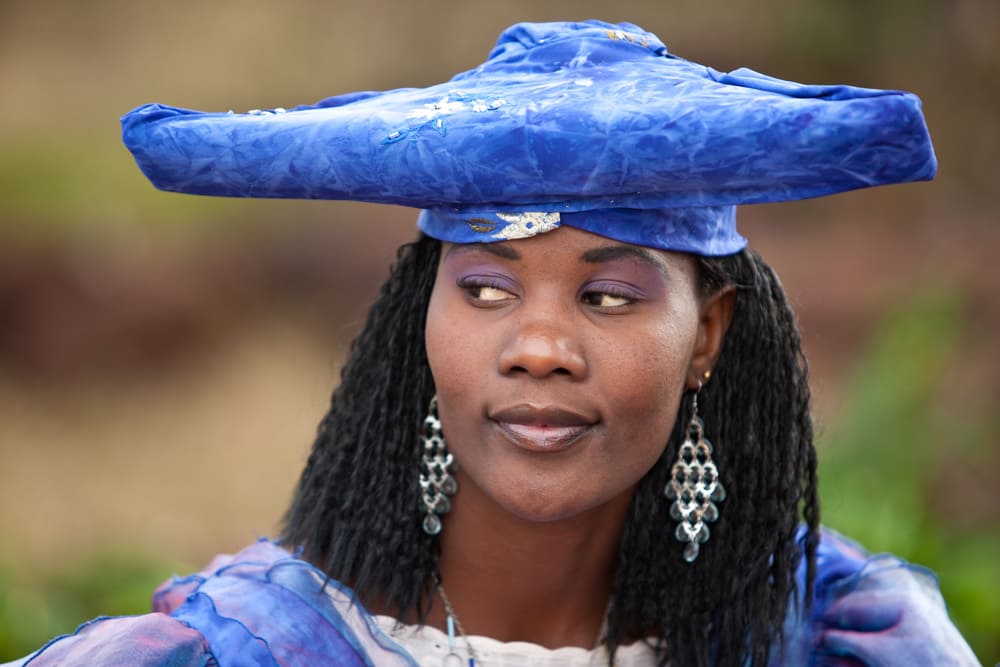 herero african girl with traditional clothing, hairstyle and jewelry, Namibia, South Africa, and Botswana